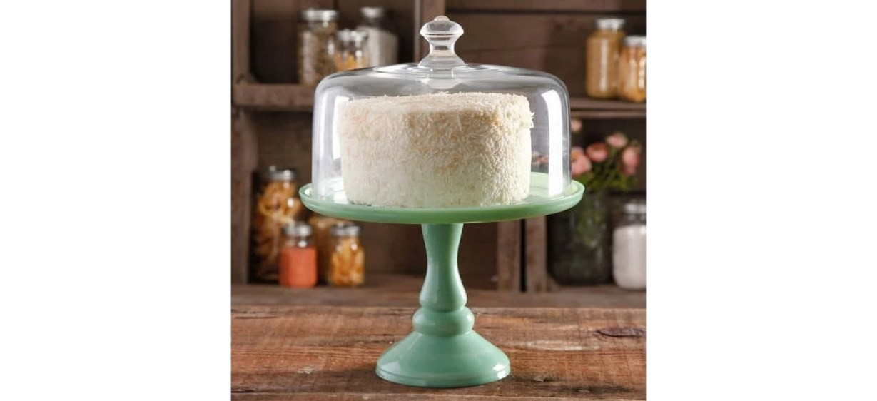 The Pioneer Woman Timeless Beauty 10-inch Cake Stand with Glass Cover on table