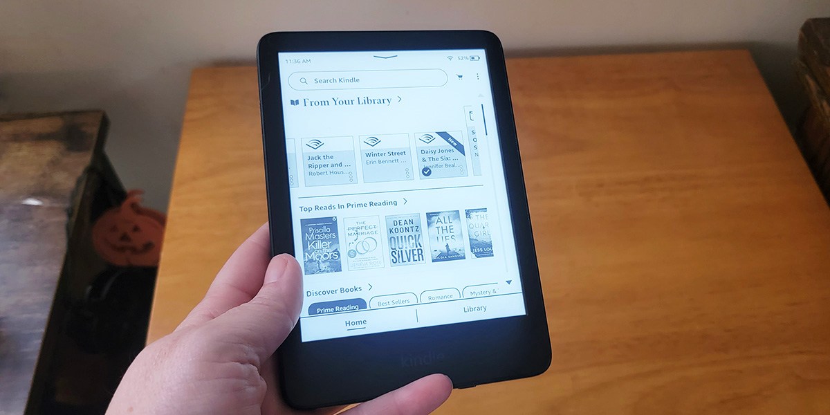 Hand holding Amazon Kindle