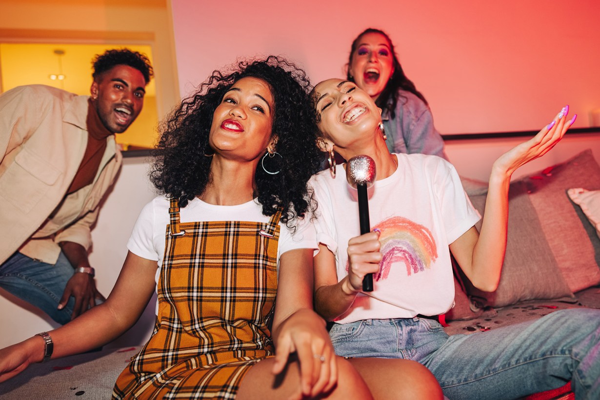 a group of friends doing karaoke