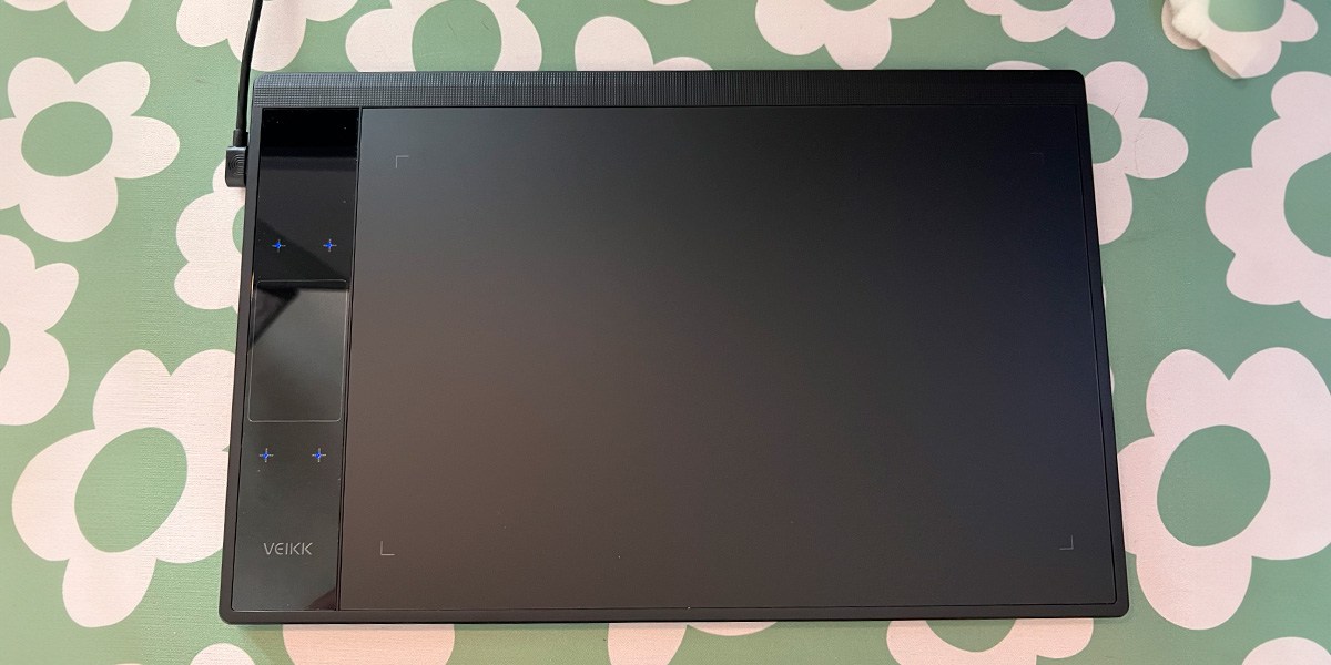 Veikk A30 V2 Drawing Tablet on green and white flowered background Veikk A30 V2 Drawing Tablet on green and white flowered background