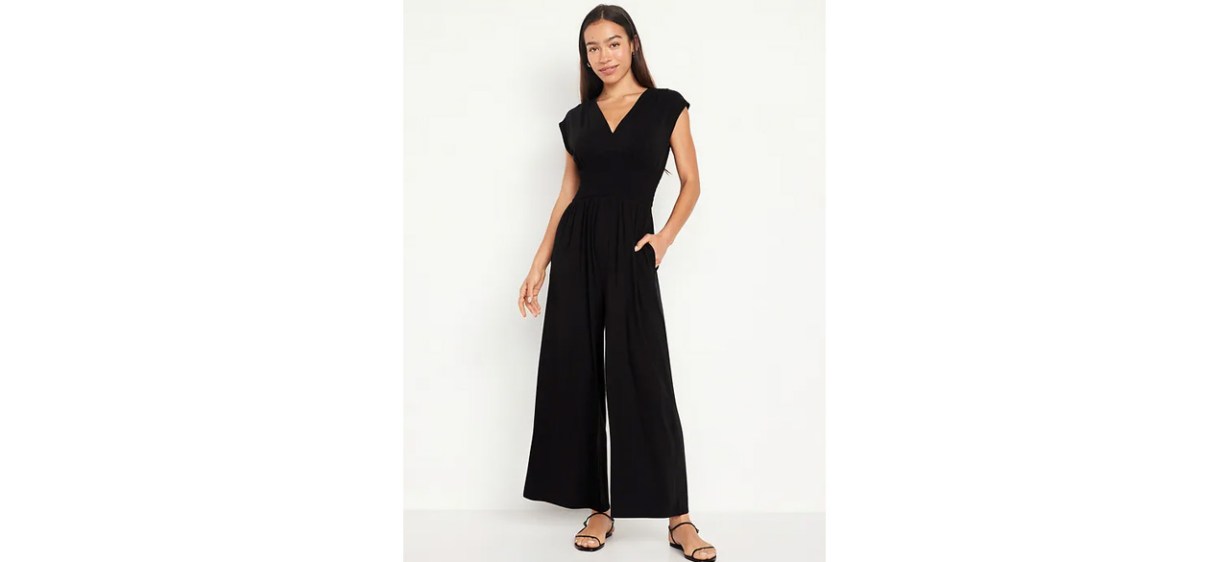 Woman wearing black Waist-Defined Shirred Jumpsuit