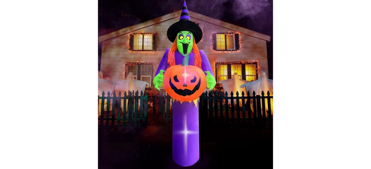 Giant Halloween inflatable witch holding pumpkin Giant Halloween inflatable witch holding pumpkin