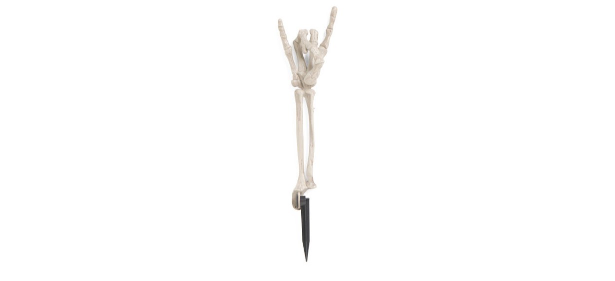 Skeleton hand stake yard decoration on white background