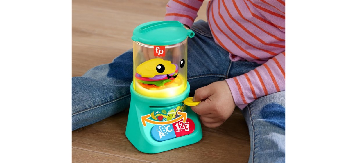 Toddler playing with Fisher-Price Laugh &amp; Learn Baby &amp; Toddler Toy Counting &amp; Colors Smoothie Maker Pretend Blender