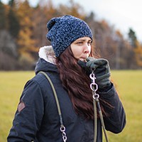 a dog trainer blowing a whistle